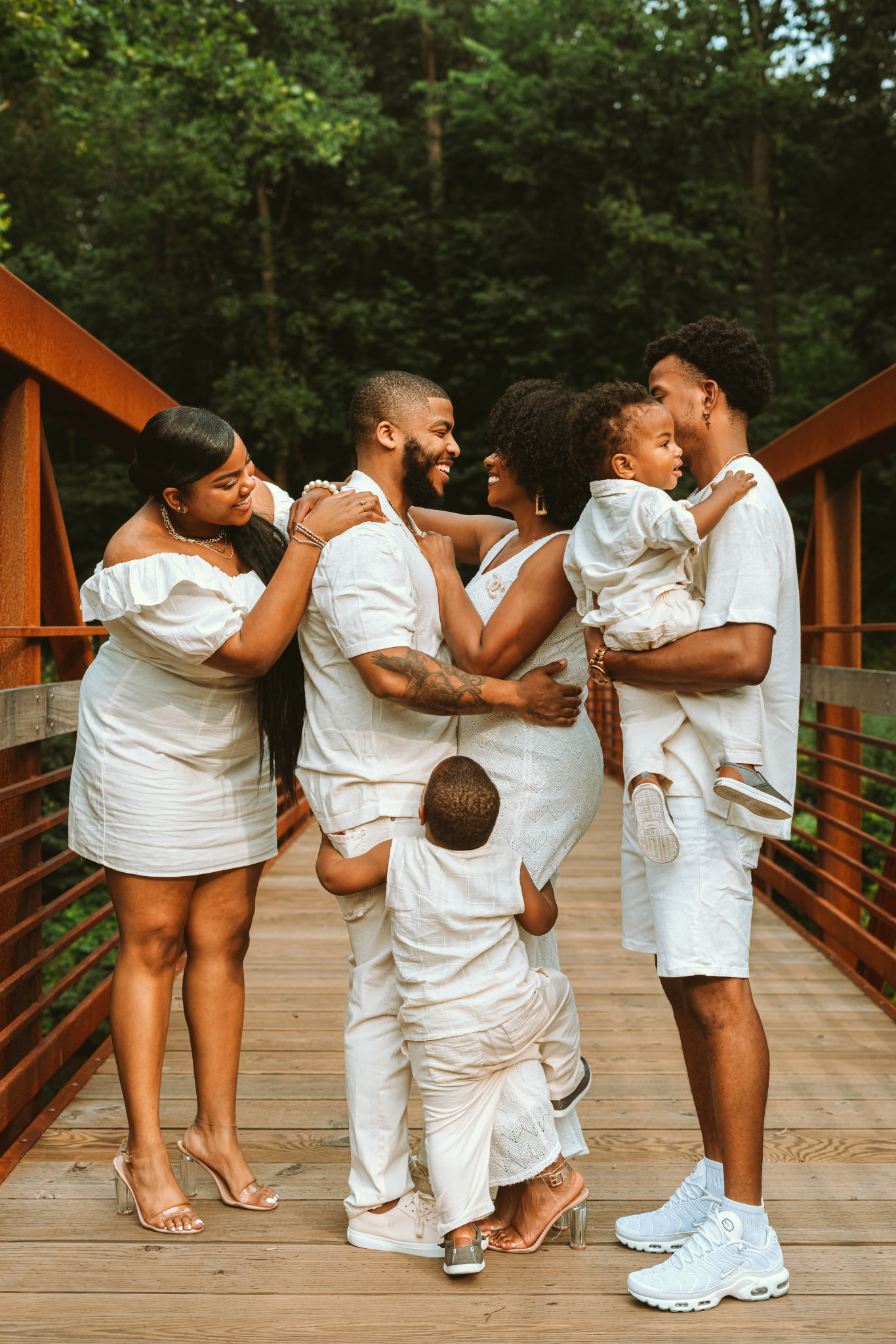 A multigenerational family sharing a joyful moment together outdoors